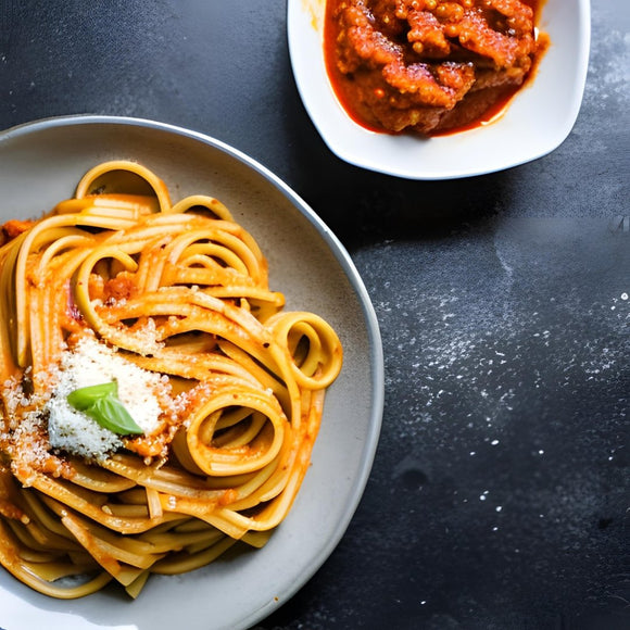 Pasta Served With A Spicy Red Pesto Sauce - SoulFlavors